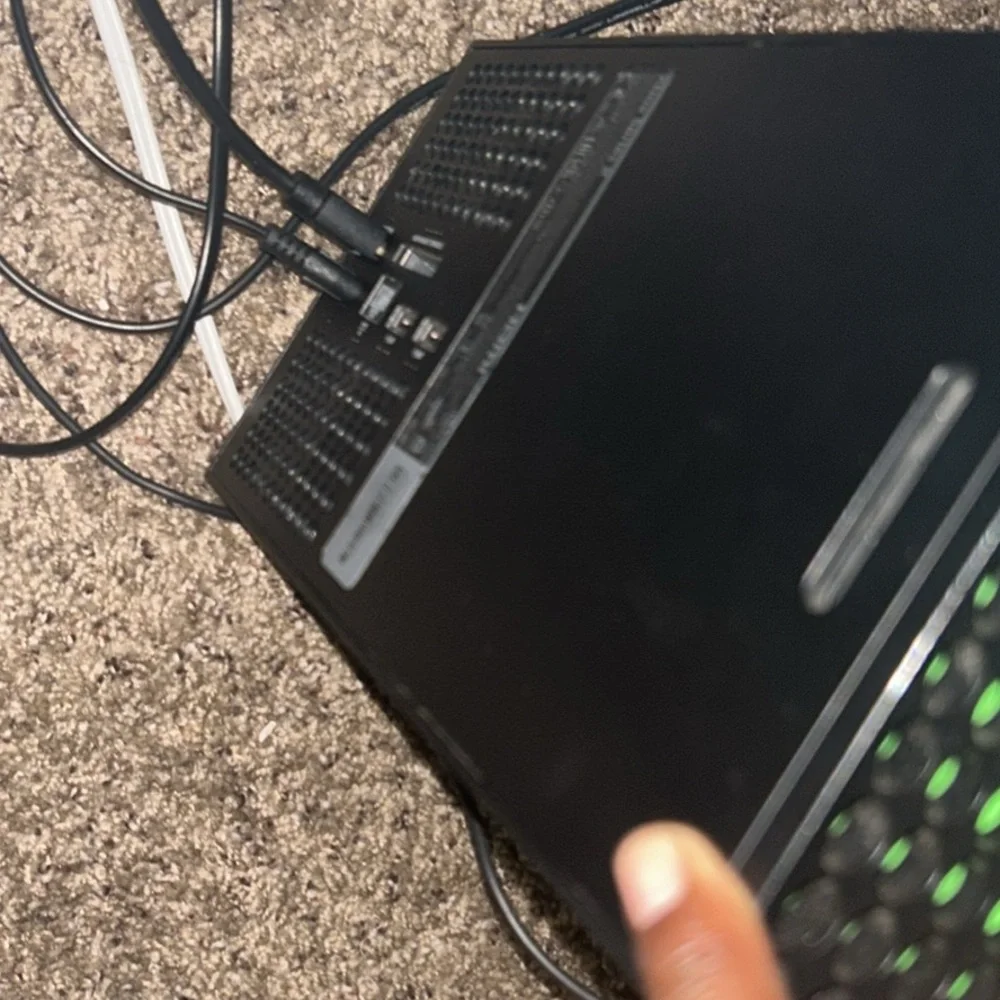 Black Gaming Console with Green Accents